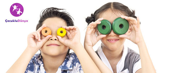 Asian boy and girl are happily playing colorful wood block toy
